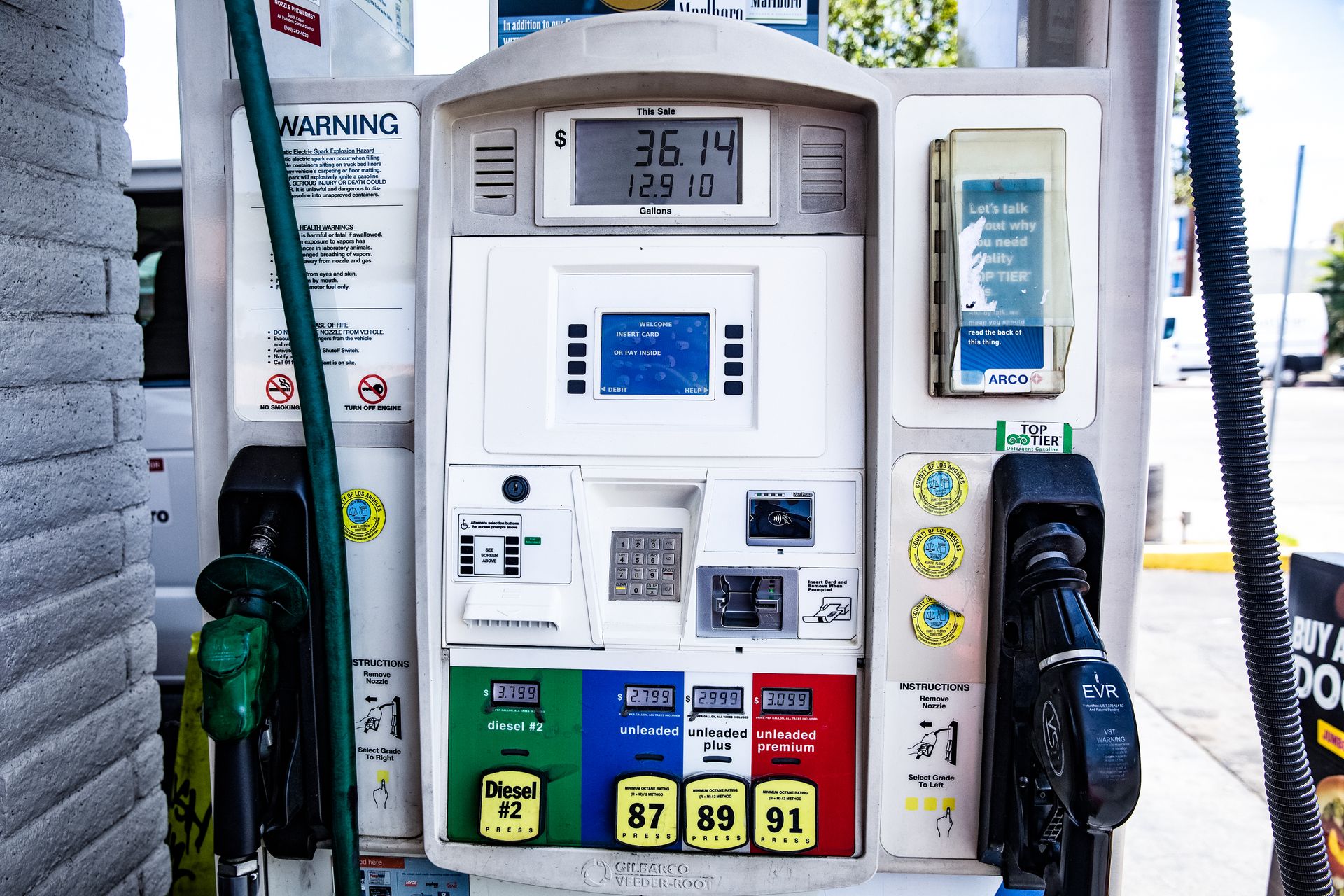 A fuel pump with a diesel nozzle and fuel selectors at a US filling station.